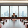 A dignified portrait of a male political leader resembling Vladimir Putin, seated at a round diplomatic table with Chinese officials, in a modern conference room with subtle Chinese architectural elements and a view of Beijing's skyline through large windows, emphasizing a serious discussion atmosphere, no text or symbols