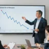 A professional economist named Berzon standing in a modern office, gesturing toward a large transparent screen that shows a descending line graph of interest rates, while a group of attentive businesspeople (the 'tulyaks') listen and discuss, with a calm and confident atmosphere, no visible text or symbols