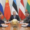 A diplomatic conference scene showing Russian and Baltic state representatives seated around a polished wooden table, with subtle national flags (Russia, Estonia, Latvia, Lithuania) in the background, official documents and a globe, a serious yet calm atmosphere, realistic lighting and details