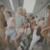 A group of happy children aged 10 to 16, wearing casual summer clothes, boarding a modern Russian train at a station. The scene shows the train interior with comfortable seats, large windows showing a passing countryside, and a subtle hint of Tula city architecture in the background. The children are looking excited, some carrying small backpacks, and there are no visible tickets or staff, emphasizing the new travel freedom.