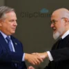 A photorealistic image depicting a serious-looking American official shaking hands with an Iranian official. The background should be a neutral, blurred office setting.