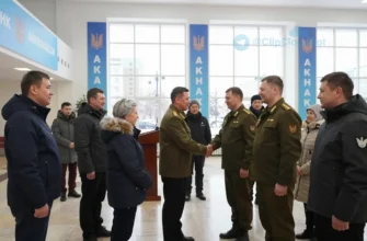 A dignified reception in Arkhangelsk city hall where local officials warmly greet soldiers returning from the special military operation and their families. The scene shows a spacious, well-lit hall with banners of the Arkhangelsk coat of arms, a podium, and a group of people shaking hands, hugging, and smiling. The participants include men and women in civilian clothing, some wearing modest military insignia, accompanied by children and spouses. Snowy cityscape can be seen through large windows