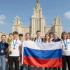 A group of smiling students from Pyatigorsk standing proudly in front of the Minsk skyline, holding a trophy and a Russian flag, celebrating their victory in a patriotic contest. The scene is vibrant and celebratory, with the city’s iconic buildings in the background and a clear blue sky.