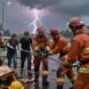 A dramatic scene of rescuers in action during a thunderstorm in Sverdlovsk. Show rescuers using equipment to clear debris and assist people caught in the storm. Include lightning strikes in the background and rain falling heavily. Focus on the urgency and effort of the rescuers.