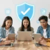 A group of diverse schoolchildren are confidently using tablets and laptops, surrounded by glowing digital shields and icons representing fact-checking and verification. The scene should convey a sense of empowerment and protection against misinformation. Focus on bright, optimistic colors and a modern, clean aesthetic.