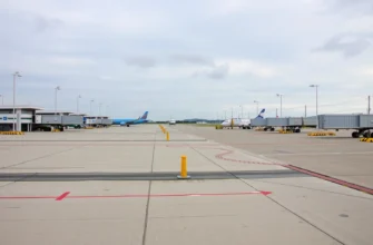 Four closed airports in Russia with empty runways, closed terminals, and no aircraft, under a cloudy sky, conveying temporary suspension of flights