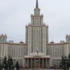 A diplomatic scene showing a Russian foreign ministry building with a solemn atmosphere, symbolizing criticism towards United Nations headquarters in the background, no people, no text, no weapons, no violence