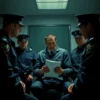 A tense police interrogation room with four officers surrounding a somber detective holding a notebook, muted colors, dramatic lighting, no text or symbols