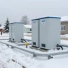 A winter scene in Lenoblast with prepared heating infrastructure and networks for the heating season, including pipelines, heating stations, and snow-covered streets
