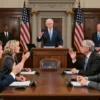 A group of diverse US representatives in a formal setting, engaged in a heated debate in the House chamber. The scene should capture the intensity of the discussion, with members gesturing and expressing strong opinions. The chamber should be detailed, with the Speaker's podium, American flags, and the historic architecture of the House visible in the background.