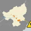 A map of Ulyanovsk Oblast highlighting areas where power outages are scheduled for July 4, with a calendar icon showing the date and a warning sign indicating electricity shutdowns, no text or numbers on the image