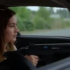 A 22-year-old woman driving a car with a visible weapon in the trunk, realistic and detailed
