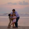 Two men assaulting a young girl on a beach at sunset, realistic lighting, natural colors, no text or symbols, no violence glorification