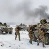 Russian military forces using new tactical formations in a battlefield environment, with soldiers in winter camouflage, armored vehicles, and smoke clouds in a snowy, war-torn landscape