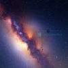 A vast, detailed view of the Milky Way galaxy stretching across the night sky, with glowing stars, dust clouds, and spiral arms extending far beyond the visible horizon, emphasizing its unexpected width and cosmic scale