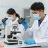 A symbolic illustration showing a water testing laboratory with scientists in white coats analyzing water samples under microscopes, with warning signs indicating low water quality, set against a backdrop of the Ural Mountains region, conveying concern and scientific scrutiny