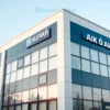 A modern office building in Aleksin, Russia, with a sign indicating "ТСН СТ «Ока»". The building should be depicted during daylight hours, showcasing its architectural details. Include a subtle indication of a sale or transfer of assets, perhaps a small, discreet icon representing a transaction.