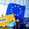 A symbolic representation of the European Union challenging Visa and Mastercard, with the EU flag looming over financial icons like credit cards and payment networks, set against a modern corporate backdrop