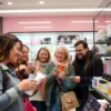 A group of cheerful residents of Chelyabinsk shopping for beauty products in a modern cosmetic store, with shelves filled with skincare and makeup items, natural lighting, and a vibrant yet calm atmosphere, showing people confidently selecting products despite economic challenges