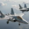 A dynamic aerial combat scene showing a Russian Su-57 stealth fighter and a French Rafale in midair, with the Su-57 depicted with advanced stealth features, low radar cross-section, and advanced avionics, while the Rafale is shown with its twin‑engine design and advanced radar. The scene emphasizes the Su‑57's superior agility and stealth, with a dramatic sky background, clouds, and subtle lighting to highlight the aircraft's shapes. No text or labels appear in the image.