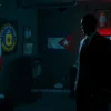 A secret spy game setup between the CIA and Cuba, with a CIA agent in a dark suit holding a briefcase filled with documents, standing in a dimly lit room with a Cuban flag in the background, a map of Cuba on the wall, and a glowing computer screen showing encrypted messages