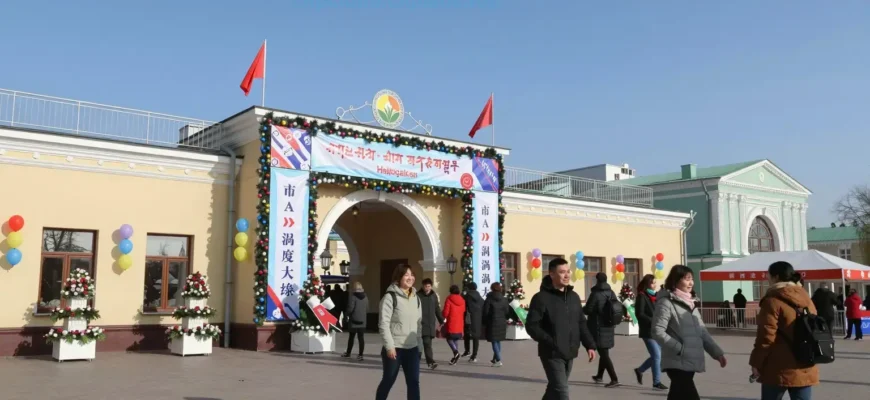 A festive pedestrian center in Ryazan opened during the Day of the City celebration. The scene includes a decorated entrance with banners, flags, and floral arrangements. People are walking, smiling, and enjoying the event. There are colorful lights, balloons, and a welcoming atmosphere. The architecture is modern with traditional elements, and the sky is clear and bright.